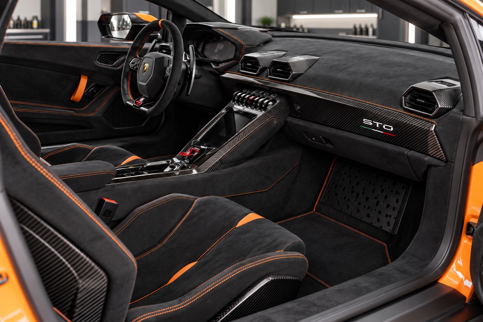 Illustrative image of a Lamborghini Huracán STO interior with black Alcantara, orange stitching, and carbon-fiber trim.